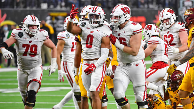 Running back Braelon Allen celebrates a first down run against Arizona State in the Las Vegas Bowl (Credit: Stephen R. Sylvanie-USA TODAY Sports)